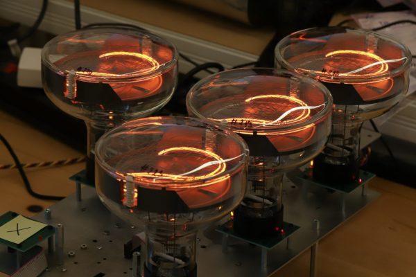 Four large nixie tubes showing the number 2