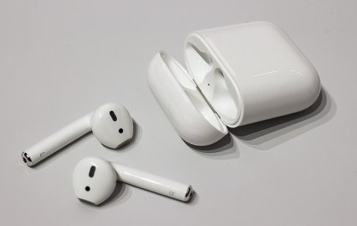 A set of Apple Airpods and their case