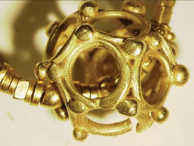 The polyhedral gold bead from Khao Sam Kaeo, in eastern peninsular Thailand, is stylistically identical to those from Oc Eo in the Mekong Delta, and to numerous similar beads from Pyu sites in Burma. (Credit: Bennett, 2009)