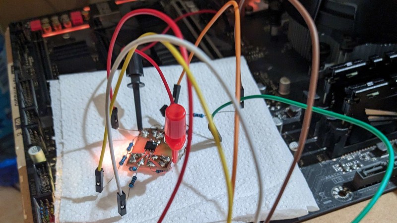 Probes connected from a Pi Pico board to the SPI flash chip, with other end of the probes connected tot the level shifter circuit resistors
