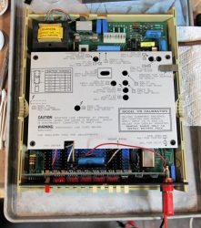 The Keithley Model 179 multimeter has a convenient calibration sequence printed on its electrostatic shield cover and a deadly exposed ac line fuse in the upper left part of the photo. (Image credit: Steven Leibson)