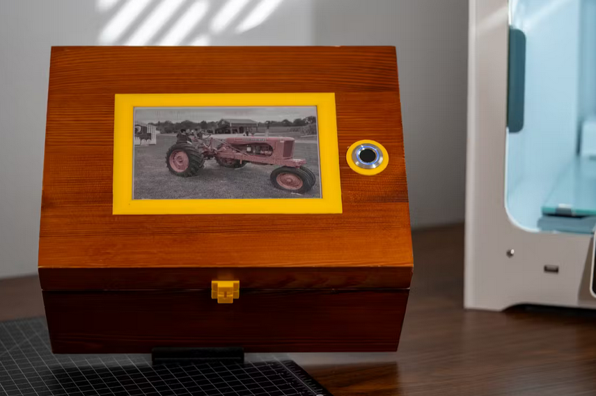 Memory box displays photos based on fingerprints