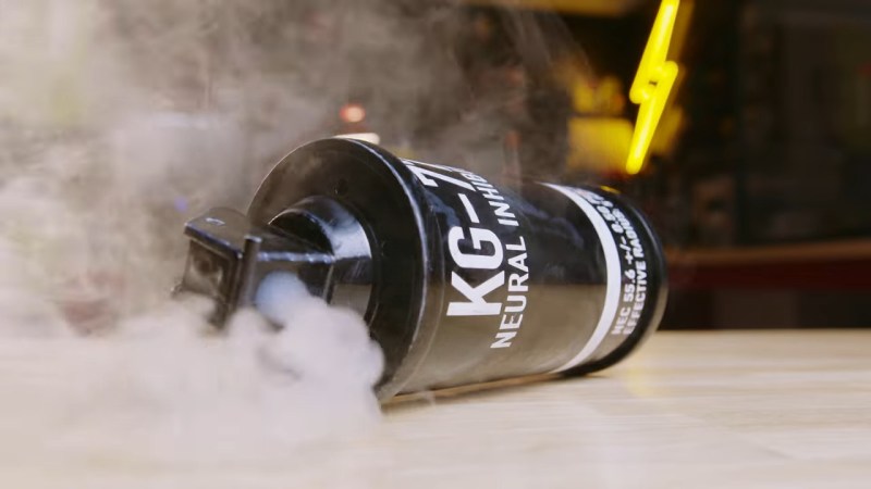 a DIY smoke grenade pours out smoke from a vape pen assembly