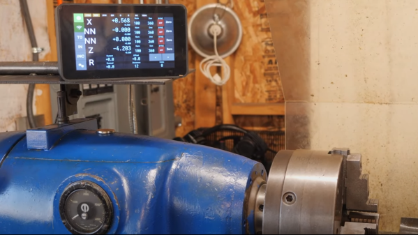 A raspberry pi-based digital readout above an old lathe