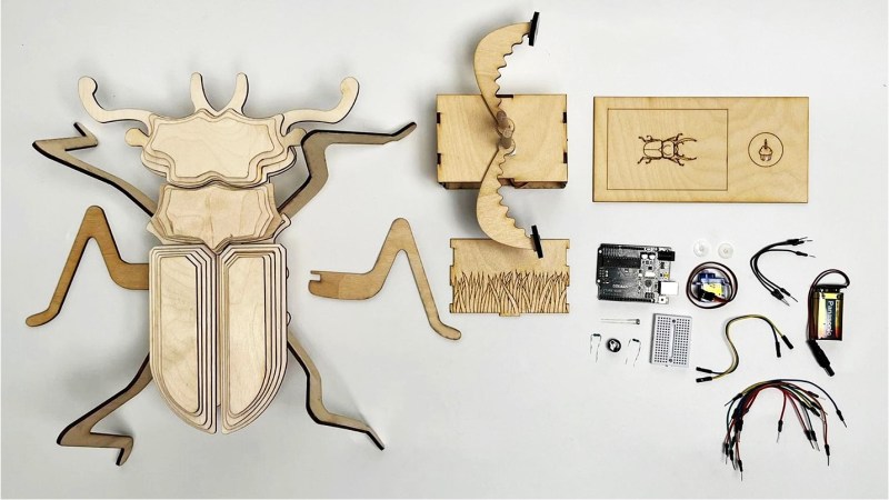 Laser cut bug body with pincers and electronics to control the pincers