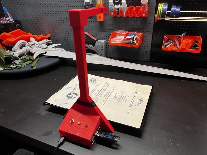A red 3D-printed Raspberry Pi-based document scanner