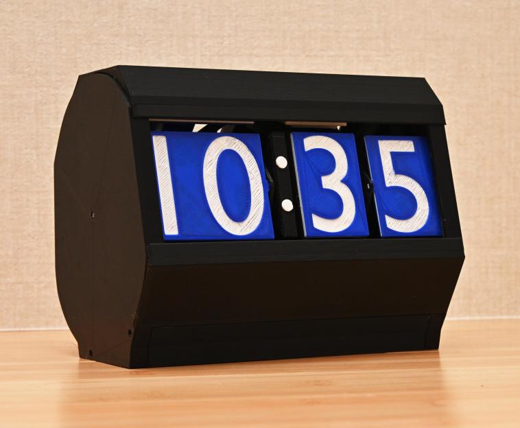 A 3D-printed clock that uses flaps for the digits that get rotated.