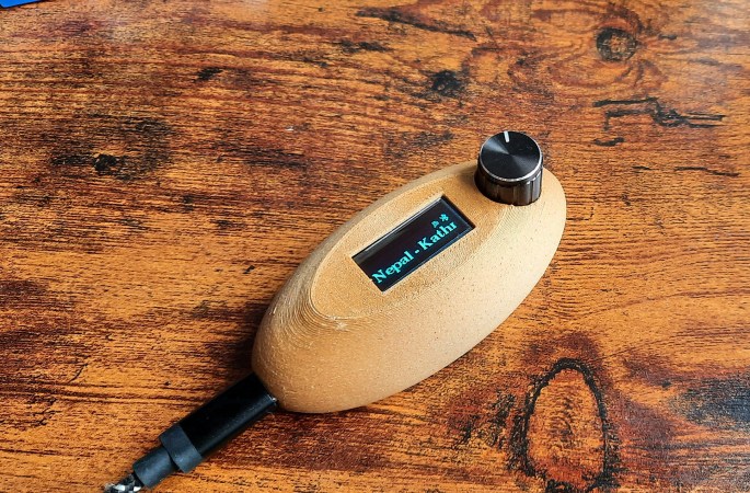 A small internet radio in 3D-printed case with a knob and an OLED screen.