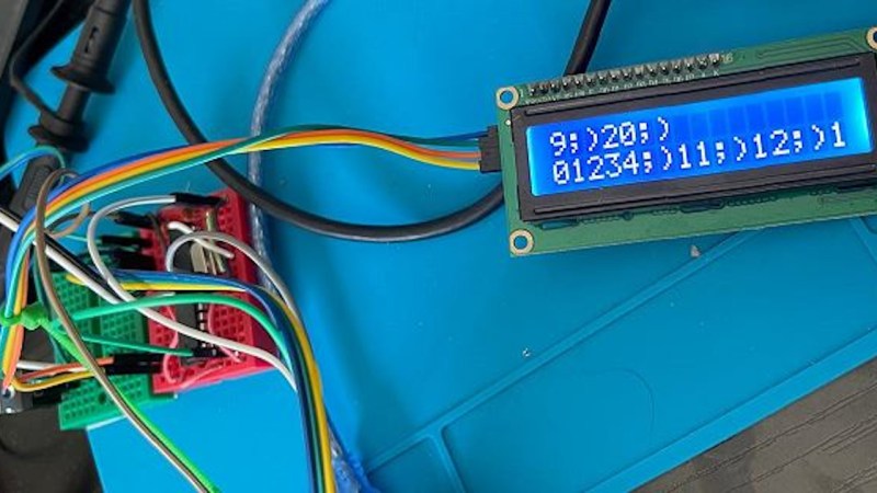 To the left, a breadboard with the ATMega328P being attacked. To the right, the project's display showing multiple ;) smiley faces, indicating that the attack has completed successfully.