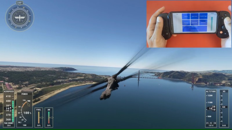 Screenshot of Microsoft Flight Simulator with the Dune expansion, and in the top right corner, the mod's author is shown using their phone with an attached gamepad for controlling a Dune ornithopter.