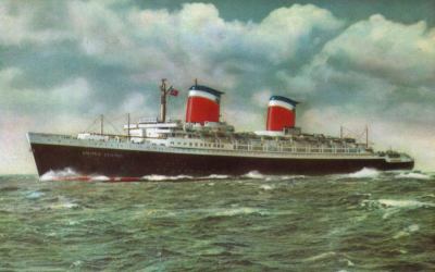SS United States colorized promotional B&W photograph. The ship's name and an American flag have been painted in position here as both were missing when this photo was taken during 1952 sea trials.