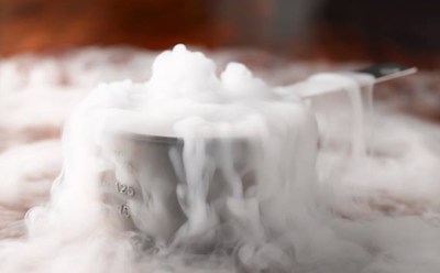 Dry ice, sublimating away in a metal measuring cup.