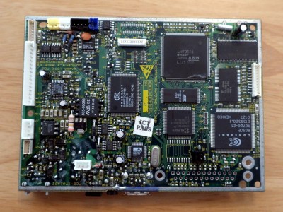 the emailer mainboard, a green printed circuit board covered in surface mount components.