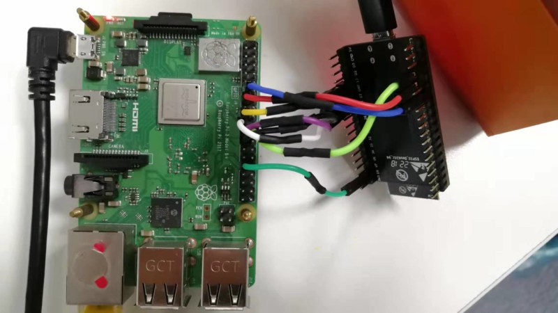 Showing a Raspberry Pi 4 board connected to an ESP32 devboard using jumper wires for the purposes of this project