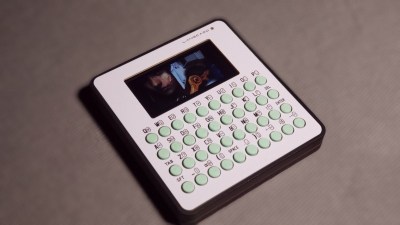 A pocket cyberdeck-looking thing with a screen and a thumb keyboard.