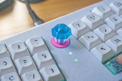 Ring Pop knob on a Le Chiffre 3D-printed small keyboard with mint chocolate chip space bars.