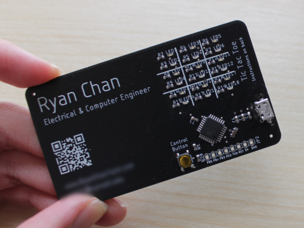 A PCB business card that plays tic-tac-toe with red and blue LEDs.