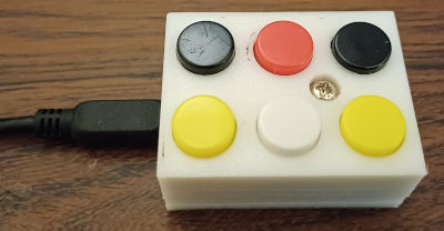 A small macro pad with six buttons.