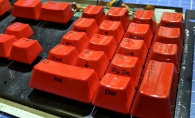 A keyboard with vacuum-former-wrapped key caps.