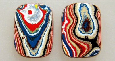 Two Fordite cabochons showing the wide variation between pieces.