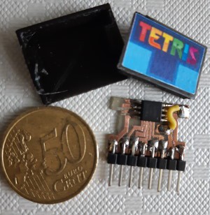 A Tetris cartridge made of a broken-out ATtiny85 and header pins.