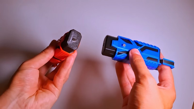 Two tools for placing magnets with ease, one for each polarity.