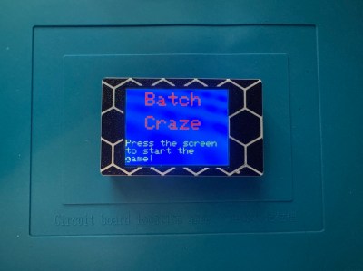 A small handheld word game called Batch Craze, where one player tries to get another to guess the word on the screen.