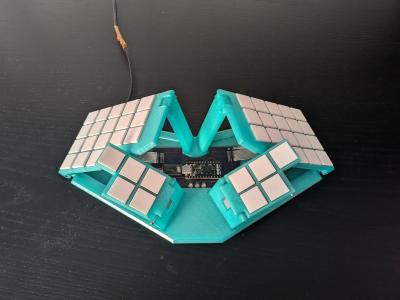 An ortholinear keyboard that resembles a butterfly and folds up.