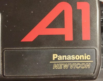 The side of a Panasonic Newvicon camera, whil both brands visible.