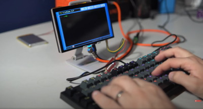 An ESP32 acts as USB host and, with a keyboard, makes a nice typewriter.