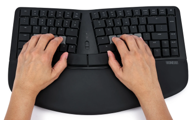 A Kinesis mWave keyboard with a pair of hands on the home row.