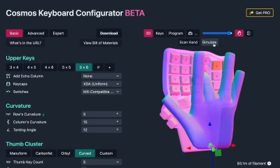 A scanned hand dances on the right half of a completely customized keyboard.