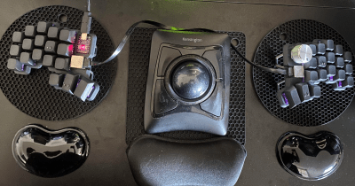 A split keyboard with tiny ball bearings on a few keys as homing devices.