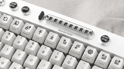 A mechanical keyboard with a word counter and a sprint timer.