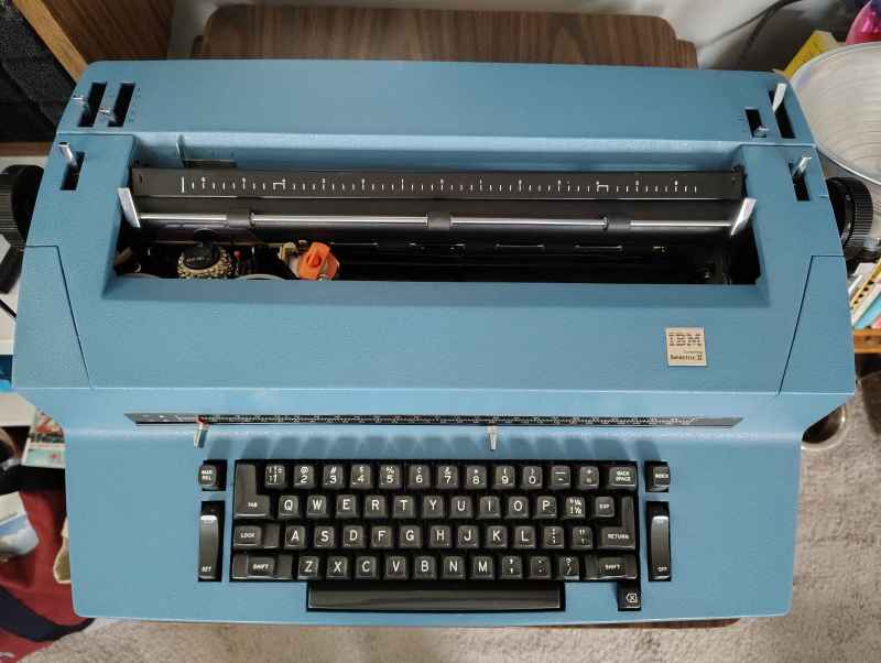 A beautiful blue IBM Selectric II typewriter.