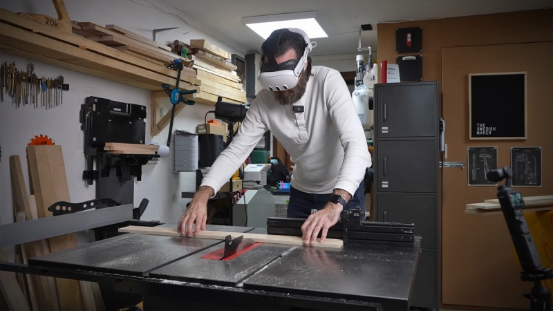 Man using a table saw with a VR headset on