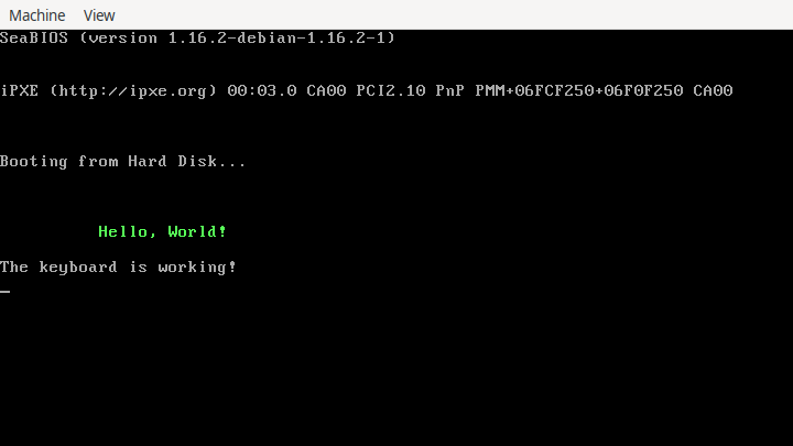 A console is shown displaying a system’s startup information, followed by “Booting from Hard Disk …”, “Hello World!” in a green font, and “The keyboard is working!”