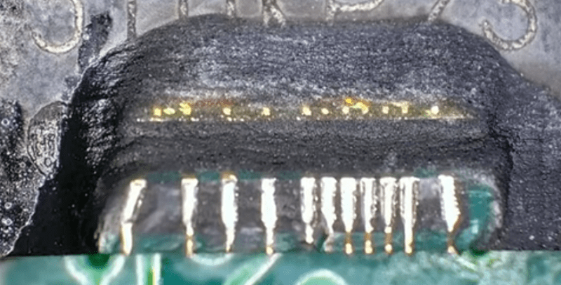 We can see the internal pads from an integrated circuit where the epoxy has been ground away.