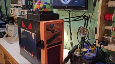 A photo of the vending machine sitting on an electronics workbench