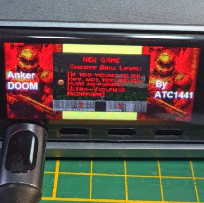 Playing a quick game of Doom while waiting for charging to finish. (Credit: Aaron Christophel, YouTube)