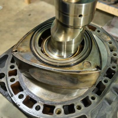 The eccentric shaft and rotor of the Mazda 12A rotary engine. (Credit: Baked Beans Garage, YouTube)