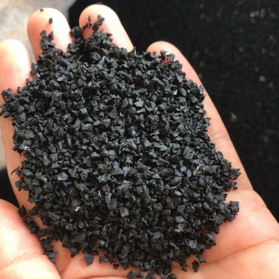 A handful of black rubber granules