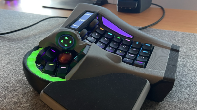 The right half of a split keyboard with integrated mouse control out the wazoo.