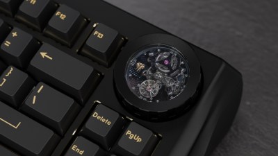 The upper right corner of a mechanical keyboard with a tourbillion watch movement that ticks along as you type and is fun to, um, watch.