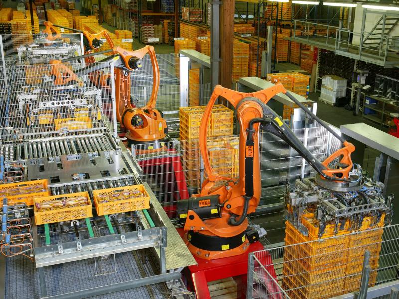 Germany bakery robots for palletizing food products. Note the plentiful safety fencing. (Credit: KUKA Roboter GmbH, Bachmann)