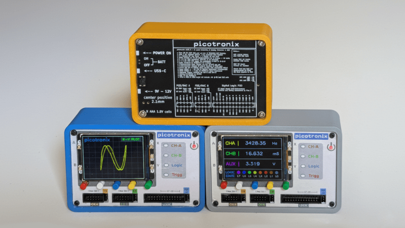 A set of three stacked oscilloscopes is shown. The lower two oscilloscopes have screens and input pins visible, and the top oscilloscope is reversed, with a printed back plate visible.