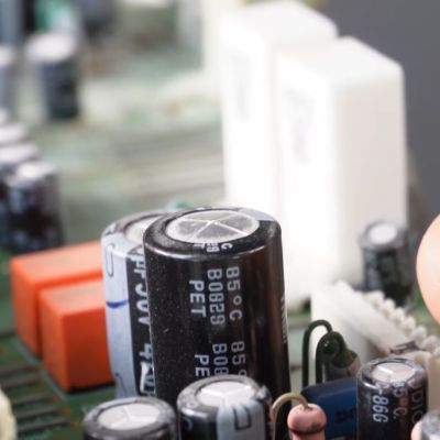 Capacitor C5662 in the Onkyo TX-SR608 receiver with a slight bulge. (Credit: Tony359, YouTube)