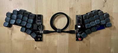 A triple-black split keyboard without a case, for now.