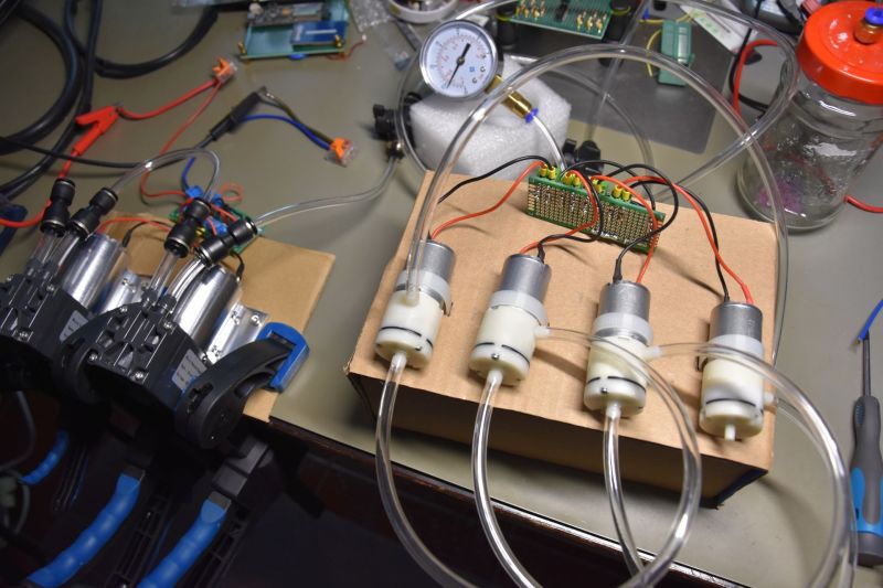 Two diaphragm vacuum pump setups with high-tech jam jar vacuum vessel. (Credit: Maya Posch)
