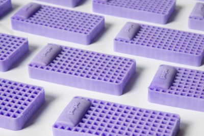 A field of Purple squishies on a white background.
